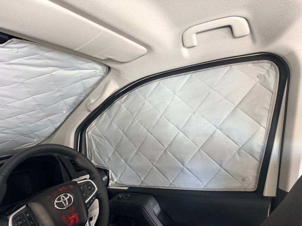Custom car window shade fitted to a vehicle door window