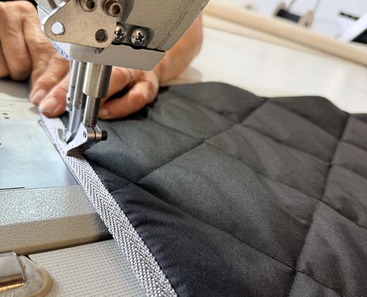 Stitching the bound edge of a custom quilted vehicle solar screen