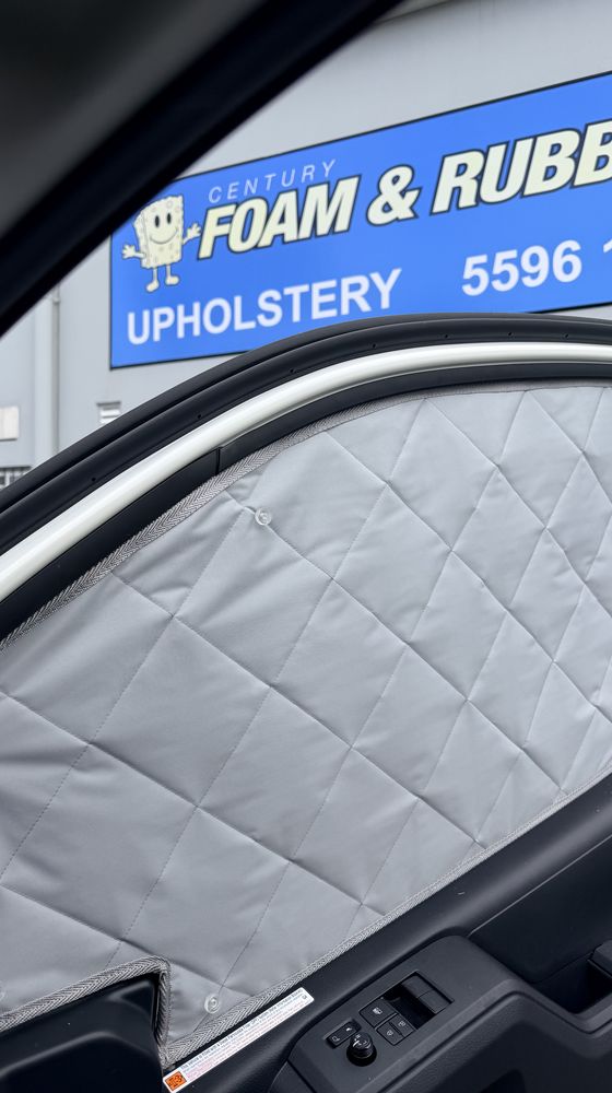 Custom quilted solar screen fitted to a vehicle door window at Century Foam and Rubber